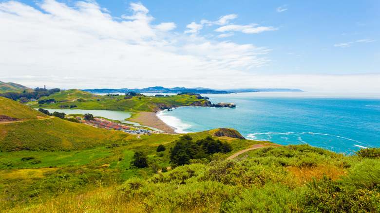 Fort Cronkhite, Rodeo Beach, and the San Francisco skyline as seen from the grassy Marin Headlands.