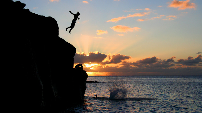 Man jumping off in Oahu