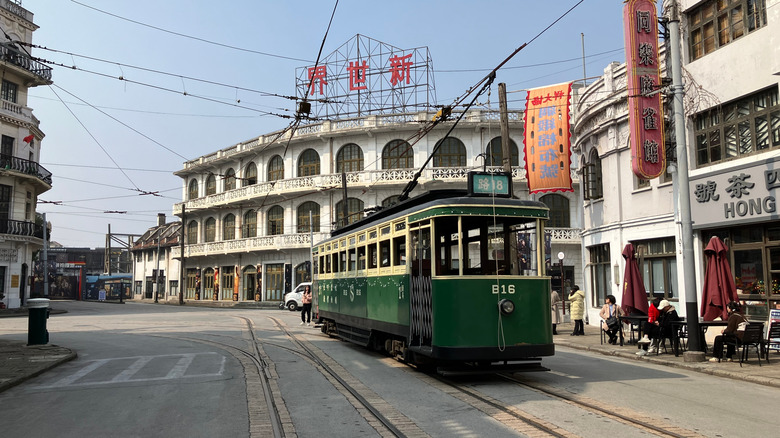 A green tramway on the streets on a set in the Shanghai Film Park.