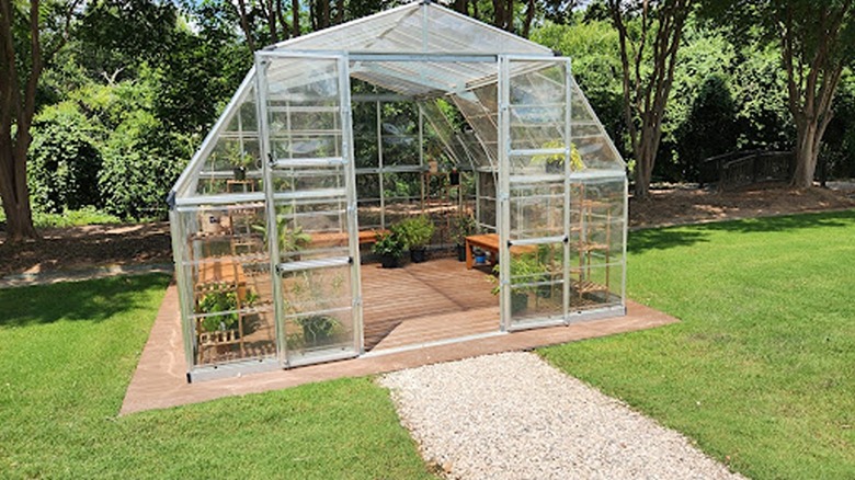 Plants inside a transparent shelter at the Carleen Bright Arboretum