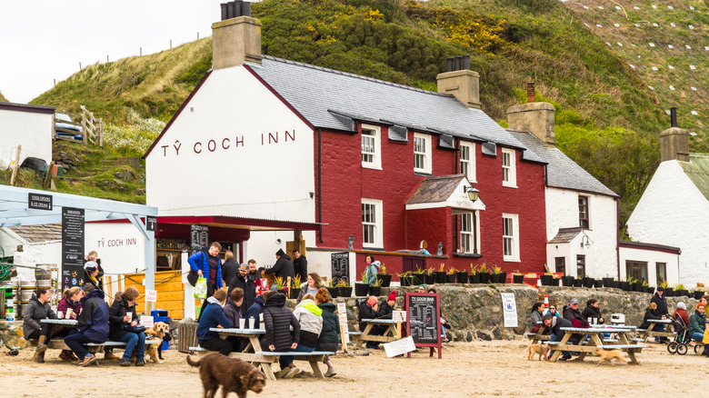 Drinkers gather at the famous Ty Coch Inn on Porthdinllaen Beach