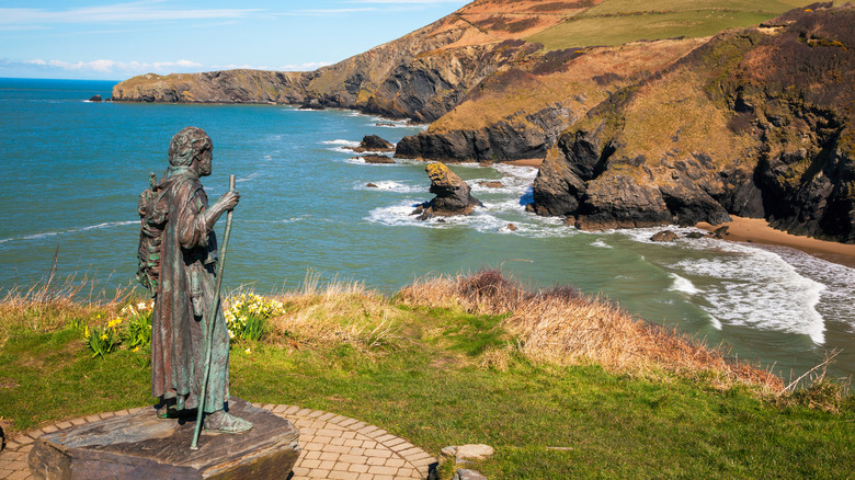 Carannog statue overlooking beach in Llangrannog