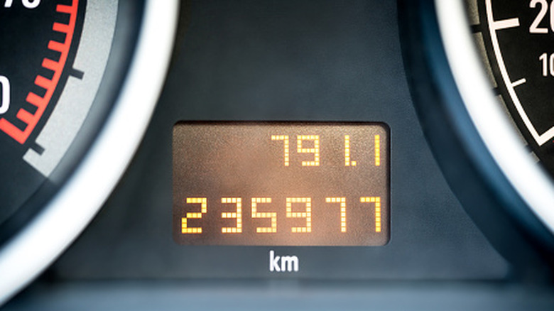 Digital odometer and mileage reading on a vehicle dashboard