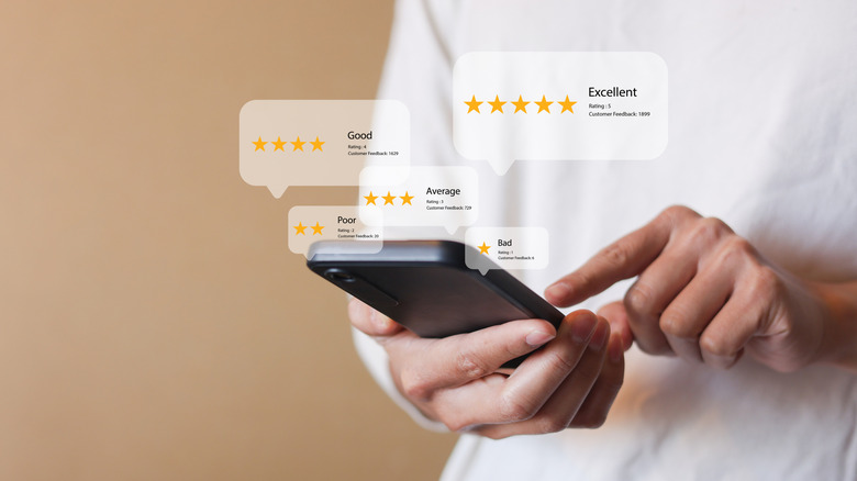 A user reading five-star reviews.