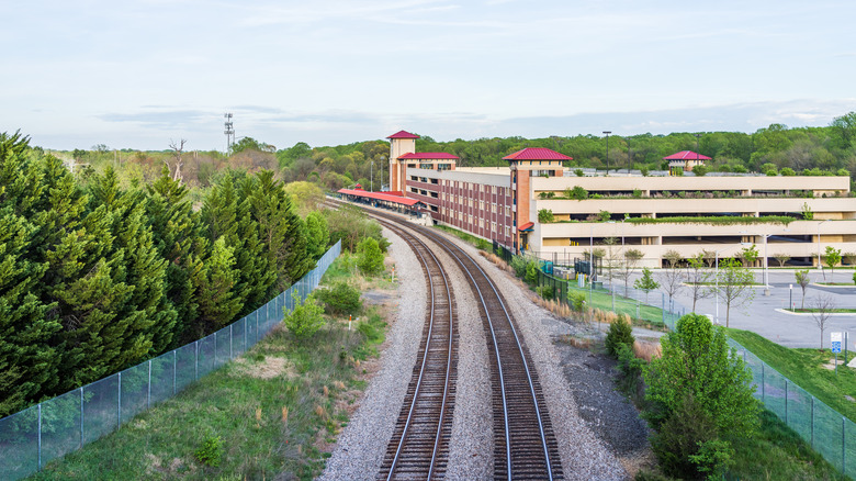 Aerial view of Burke Centre train station with parking garage nearby in Virginia during the day.
