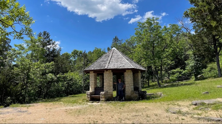 A stone pavilion at Washington State Park in Missouri on a sunny day