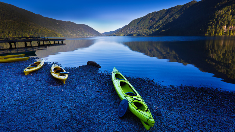 Kayaks on the shore of Lake Crescent, Washington state, USA