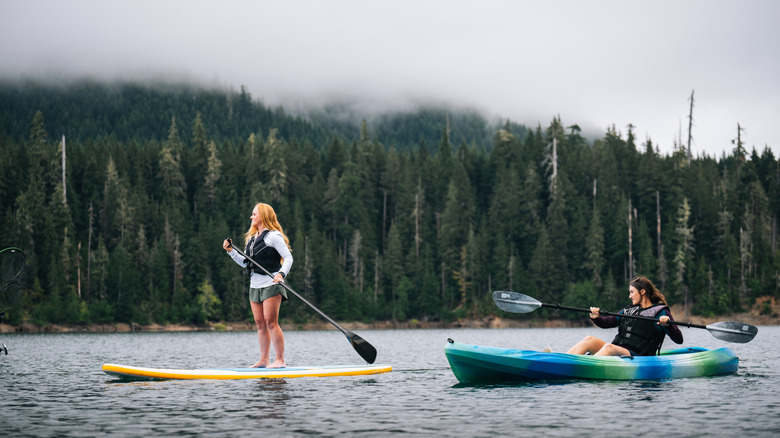 Two women out on a paddle board and kayak on Lake Kachness