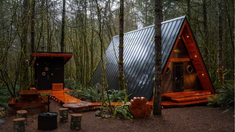 Handcrafted A-frame Airbnb and its private cedar sauna.