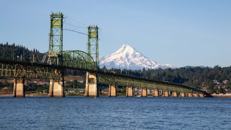 A bridge over the Columbia River near downtown White Salmon, Washington, with a snowy mountain peak in the distance