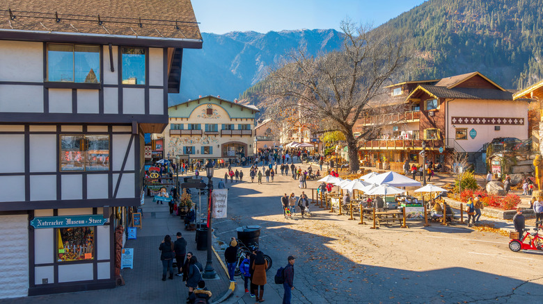 Shops and sidewalk cafes line the quaint Bavarian themed main street of Leavenworth, Washington