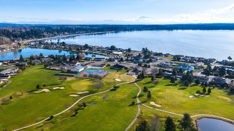 Aerial view of Birch Bay, WA, with a tennis courts a golf course and the bay in the background
