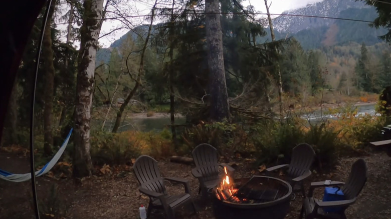 A campsite at The Landing at dusk with a firepit