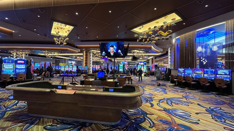 Slot machines and tables on the casino floor at Ilani Casino