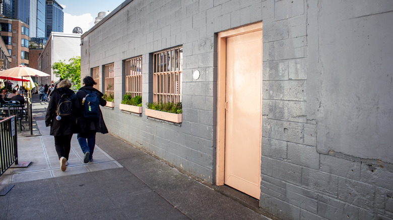 The pink door entrance to Seattle restaurant The Pink Door in Pikes Place Market