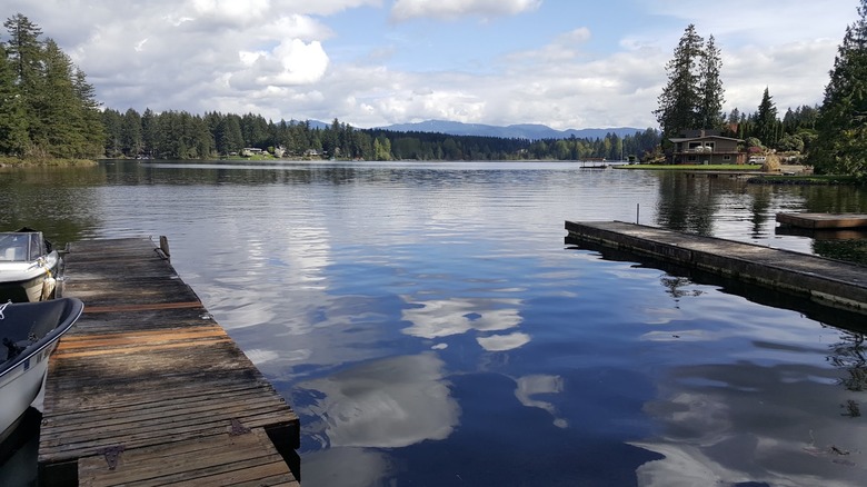 Lake Sawyer in Black Diamond with dock in foreground and mountains in background.