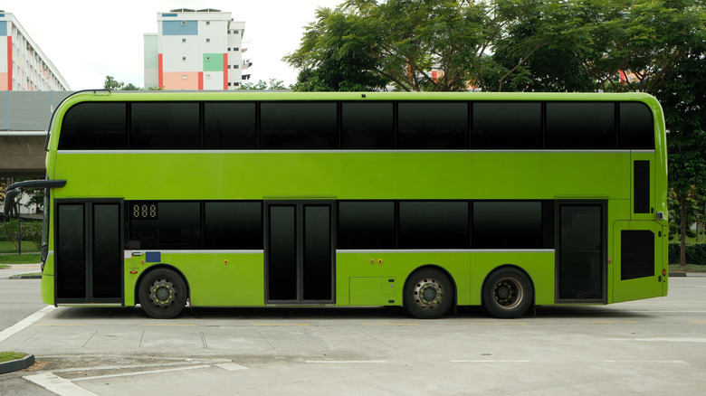 A green double-decker bus