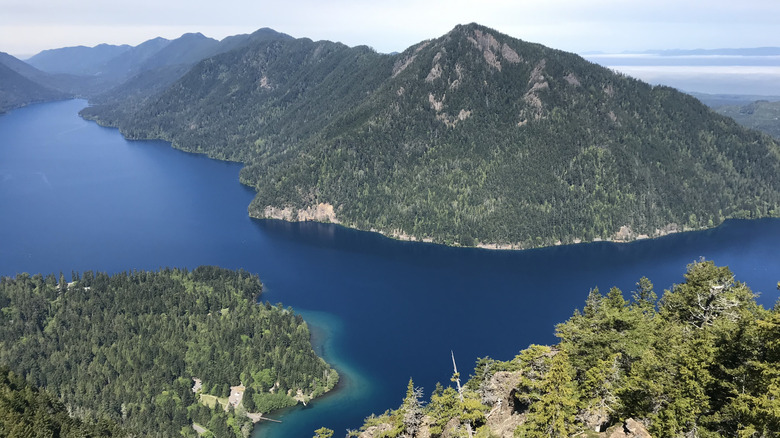 Blue water of Lake Crescent and impressive mountains from Mount Storm King Trail