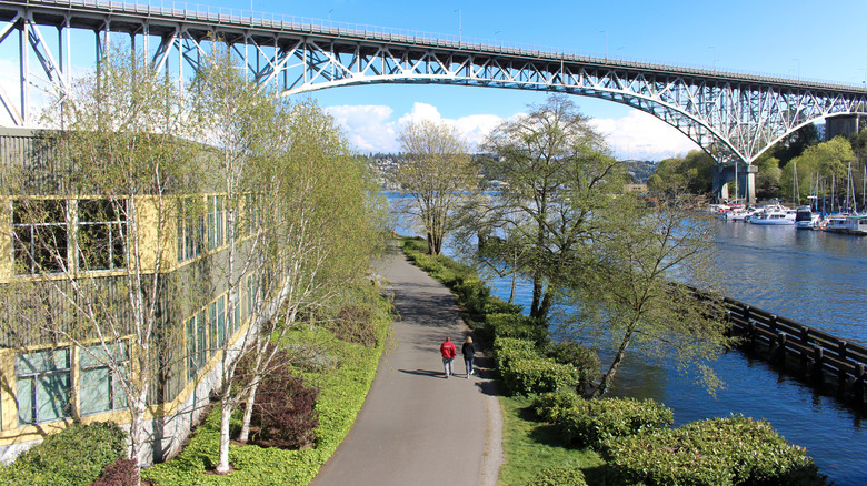 Cyclists on the Burke-Gilman Trail going under Aurora Bridge in Seattle