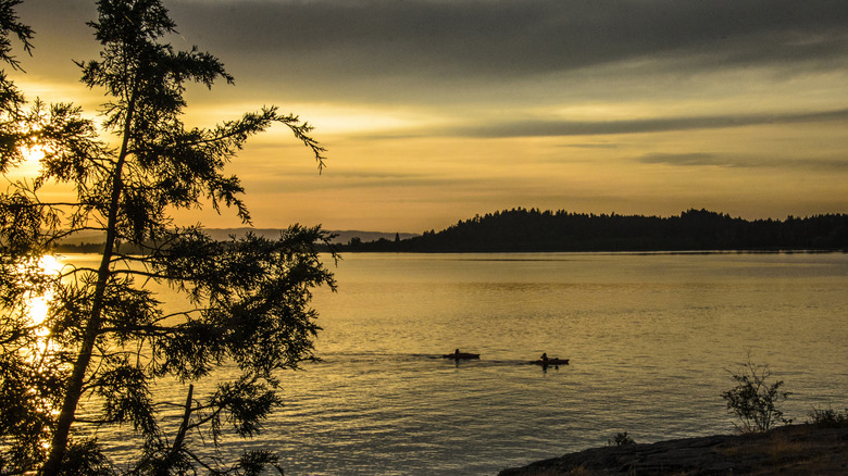 Kayakers on Flathead Lake, Montana, at sunset