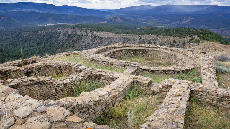 Ancestral Puebloan stone kivas amid the mountains at Chimney Rock National Monument