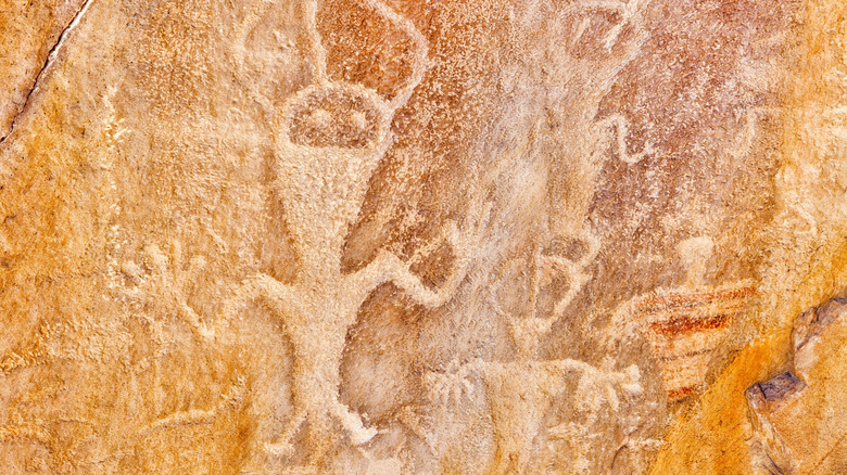 A close-up of Native American petroglyphs on rock at Dinosaur National Monument, located in Utah and Colorado