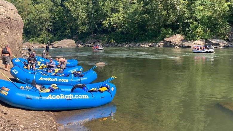 A group of adventurers get in their rafts at ACE Adventure Resort