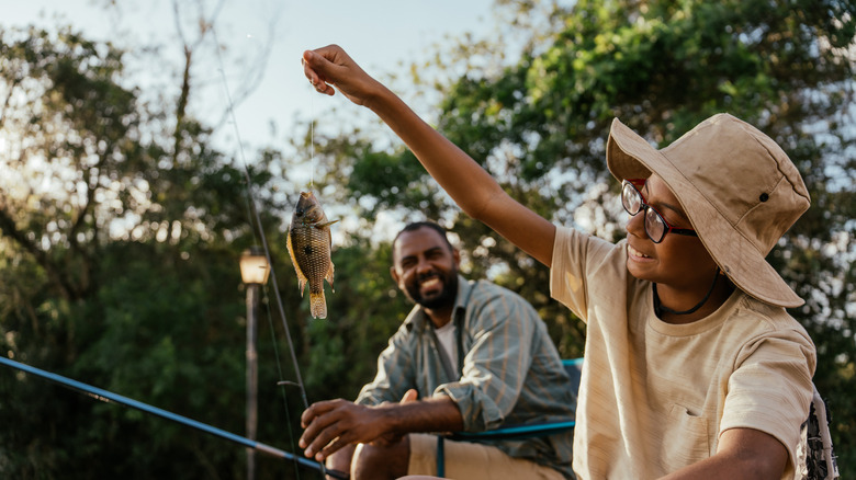 Father and son fishing together