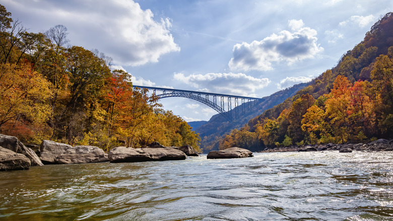 The New River Gorge Bridge surrounded by fall colors from the New River, West Virginia