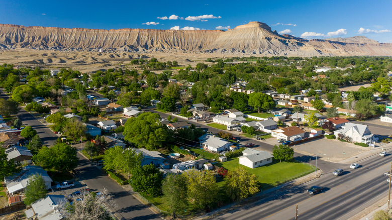 Dusty mountains rise behind the town of Grand Junction, Colorado