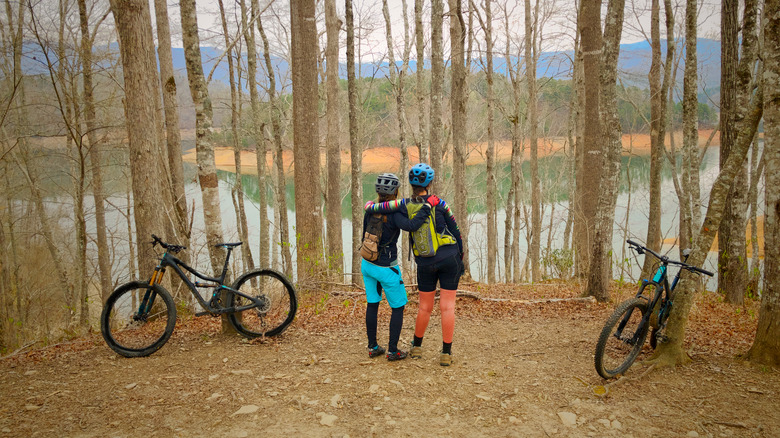 Mountain bikers resting along the trail and taking in views at Tsali Recreation Area