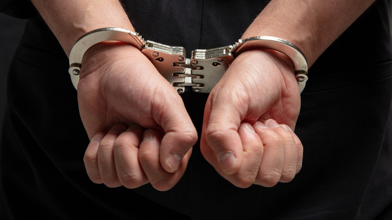 Hands in handcuffs close-up