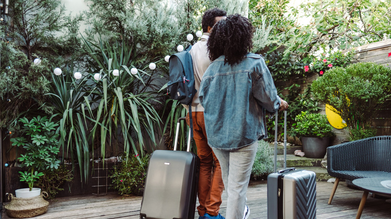 Couple checking into a bed and breakfast