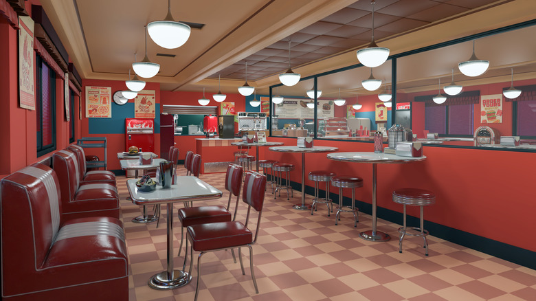 A retro American diner, pictured empty with set tables