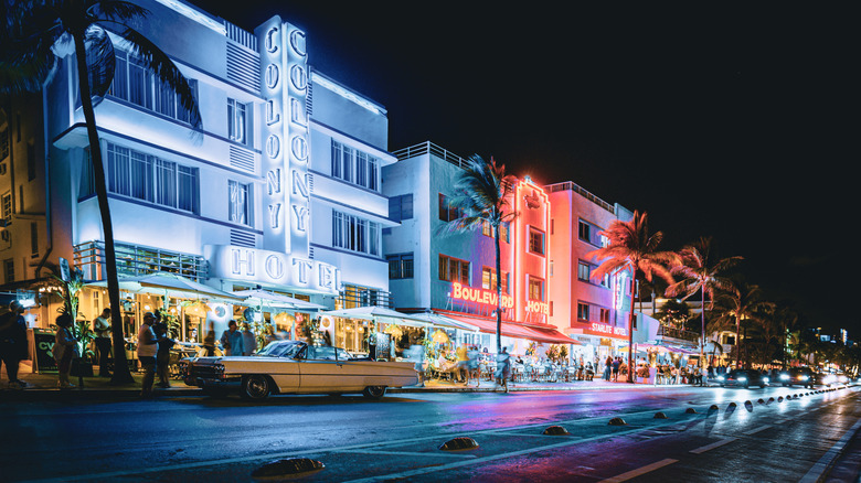 Ocean Drive in Miami at night with neon-colored lights