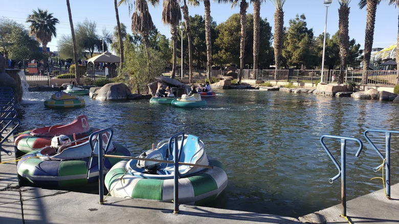 Empty bumper boats sitting in the water at CrackerJax amusement park in Arizona.