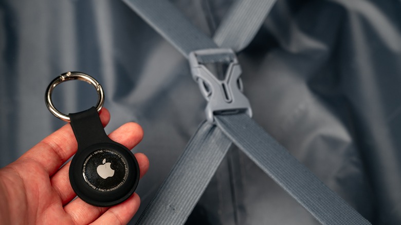 Person holding an AirTag