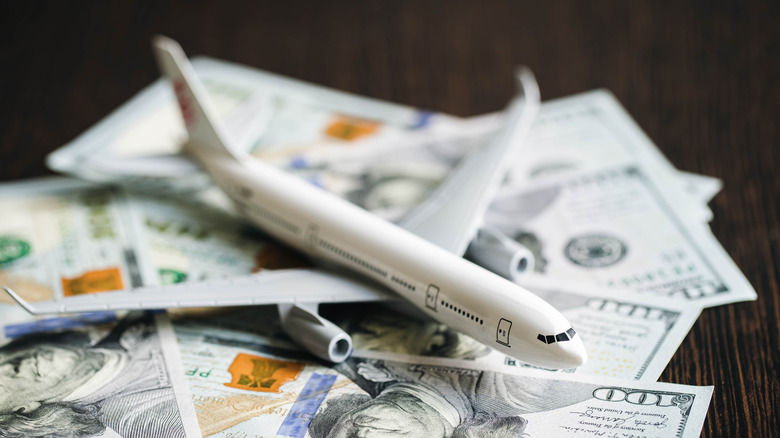 Airplane on stack of money