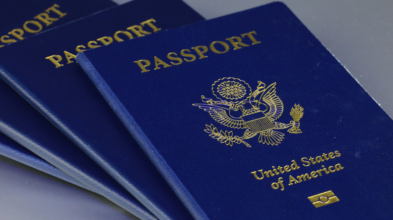 Several American passports stacked on top of each other