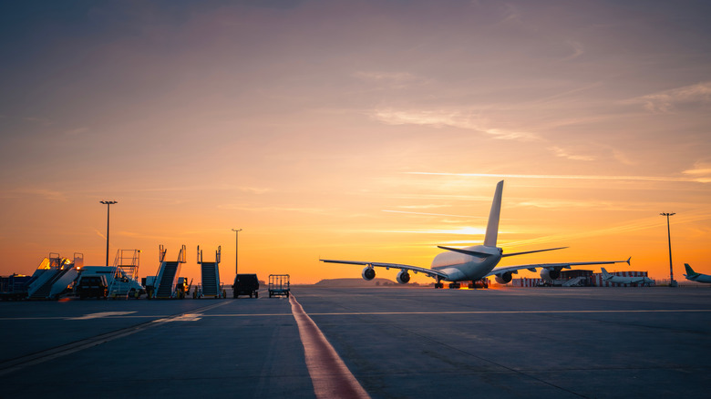 plane preparing for takeoff at sundown
