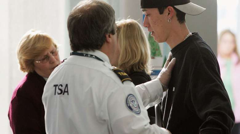 Someone getting a pat-down at airport security