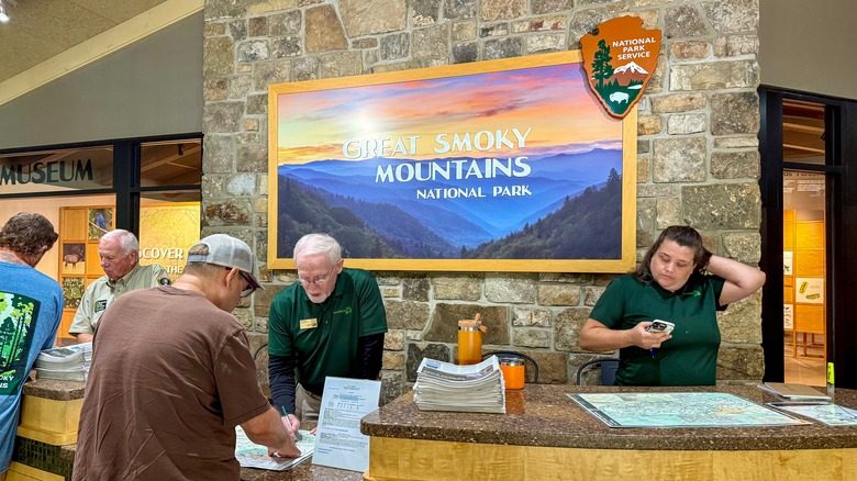 National park rangers welcome visitors to the Great Smoky National Park in Gatlinburg, TN