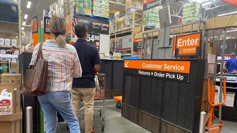 Customers at a returns desk at Home Depot