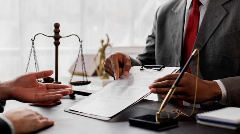 Customer speaking with a lawyer about documents