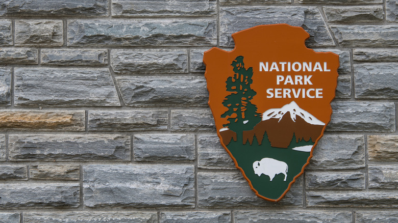 The National Park Service sign on a brick wall