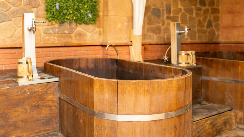 A beer spa with a tub and beer tap