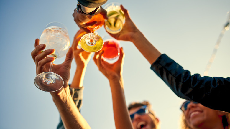 People toasting with alcohol