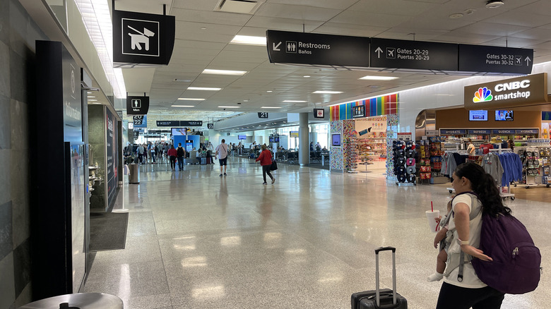 People walking through the clean terminal at Houston Hobby Airport.