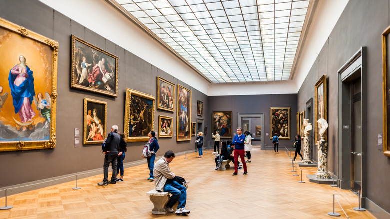 European Paintings Gallery with paintings displayed on the walls and visitors looking at the artwork, Metropolitan Museum of Art