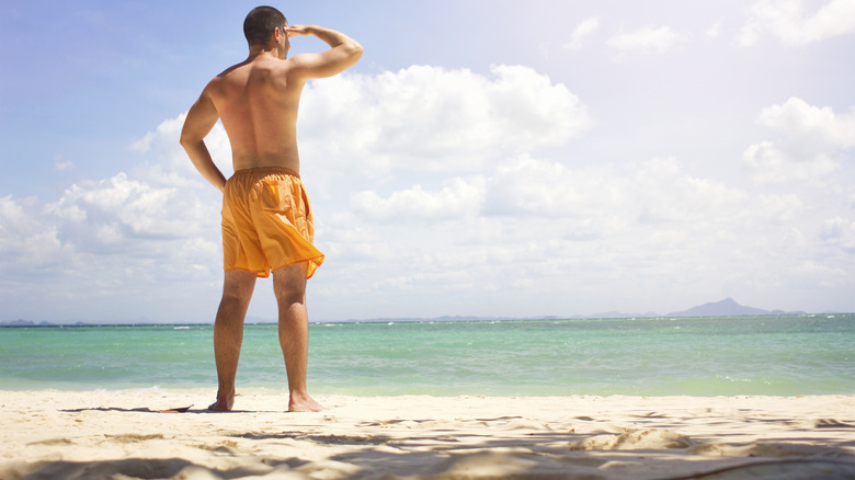 Man looking at the beach 